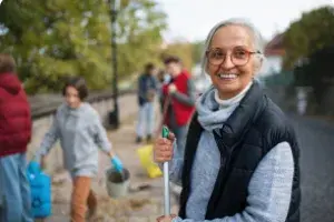 Older female volunteer smiling