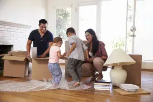 Young family working together in their home