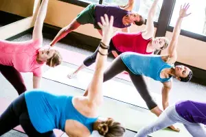 Group of people doing a yoga pose